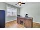 Home office with hardwood floors, natural light, and a ceiling fan at 203 Plowden Mill Ct, Summerville, SC 29485