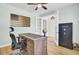 Well-appointed home office with hardwood floors, modern desk, and French doors at 203 Plowden Mill Ct, Summerville, SC 29485