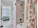 View of neutral tiled shower with dark fixtures from bedroom at 203 Plowden Mill Ct, Summerville, SC 29485