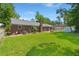 Brick home with a large backyard, storage shed, and garage at 204 Runnymede Ln, Summerville, SC 29485
