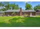 Brick home features a large backyard and chimney at 204 Runnymede Ln, Summerville, SC 29485