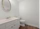 Clean bathroom with a vanity, decorative mirror, and tiled shower-tub, ensuring a comfortable space at 204 Runnymede Ln, Summerville, SC 29485