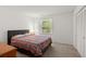 Cozy bedroom with soft carpet, a comfortable bed, and a window offering natural light at 204 Runnymede Ln, Summerville, SC 29485