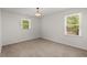 Bright and airy bedroom with neutral tones, carpet flooring and large windows offering ample sunlight at 204 Runnymede Ln, Summerville, SC 29485