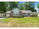 Charming single-Gathering home with brick and siding exterior, lush lawn, and attached garage at 204 Runnymede Ln, Summerville, SC 29485