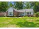 Inviting one-story home with well-maintained lawn and landscaping at 204 Runnymede Ln, Summerville, SC 29485