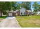 Attractive single-Gathering house with a long driveway and green lawn at 204 Runnymede Ln, Summerville, SC 29485