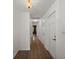 Hallway with hardwood floors, doors, and white walls at 204 Runnymede Ln, Summerville, SC 29485