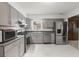 Well-equipped kitchen featuring stainless steel appliances, gray cabinetry, and stylish countertops at 204 Runnymede Ln, Summerville, SC 29485