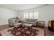 Bright living room with hardwood floors, large windows, and neutral decor at 204 Runnymede Ln, Summerville, SC 29485
