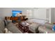 Spacious living room featuring modern decor, a large TV, and comfortable seating at 204 Runnymede Ln, Summerville, SC 29485