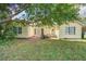 Backyard view showing the grass, patio area, and the exterior of the home at 210 Allen Richard Ct # A&B, Moncks Corner, SC 29461