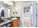 Bathroom with a large mirror, vanity, and view of the adjacent tub area at 210 Allen Richard Ct # A&B, Moncks Corner, SC 29461
