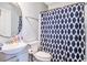 Bathroom featuring a sink and toilet behind a blue-and-white shower curtain at 210 Allen Richard Ct # A&B, Moncks Corner, SC 29461