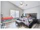 Bedroom featuring a ceiling fan, a window, and a bed with a floral pattern comforter at 210 Allen Richard Ct # A&B, Moncks Corner, SC 29461