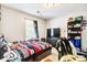 Bedroom featuring black out curtains, a TV, and shelving with decorations at 210 Allen Richard Ct # A&B, Moncks Corner, SC 29461