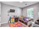 Bedroom with desk, mounted TV and colorful rug on the hardwood floor at 210 Allen Richard Ct # A&B, Moncks Corner, SC 29461