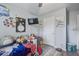 Bright bedroom with hardwood floors, wall decor and a mounted TV at 210 Allen Richard Ct # A&B, Moncks Corner, SC 29461