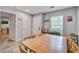 Dining room featuring a long table, hardwood floors, and a view to the kitchen at 210 Allen Richard Ct # A&B, Moncks Corner, SC 29461