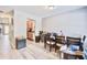 Dining area leads to kitchen; note wood-look floors, modern lighting, and neutral wall color at 210 Allen Richard Ct # A&B, Moncks Corner, SC 29461