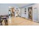 Open dining room featuring a long wooden table, a view to the kitchen, and an adjoining hallway at 210 Allen Richard Ct # A&B, Moncks Corner, SC 29461