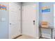 Functional foyer features a white closet door, gray front door, and neutral-toned walls at 210 Allen Richard Ct # A&B, Moncks Corner, SC 29461