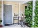 Close up of front porch with seating area and a 'home' welcome mat at 210 Allen Richard Ct # A&B, Moncks Corner, SC 29461
