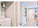 Bright hallway with wood floors, white doors and a washer/dryer unit in an alcove at 210 Allen Richard Ct # A&B, Moncks Corner, SC 29461