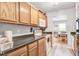 Well-lit kitchen with light wood cabinetry, modern appliances, and view of dining area at 210 Allen Richard Ct # A&B, Moncks Corner, SC 29461