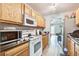 Efficient kitchen features wood cabinets, black countertops, and modern appliances for a functional space at 210 Allen Richard Ct # A&B, Moncks Corner, SC 29461