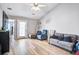 Bright living room features a vaulted ceiling, wood-look floors, and comfortable seating arrangements at 210 Allen Richard Ct # A&B, Moncks Corner, SC 29461