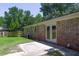 Spacious backyard with mature trees and a patio, perfect for outdoor entertaining at 210 Froman Dr, Summerville, SC 29483