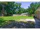 Expansive backyard with well-maintained lawn and mature trees, creating a private retreat at 210 Froman Dr, Summerville, SC 29483
