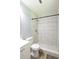 Modern bathroom showcases tiled shower, white vanity, and matching toilet for a clean, updated look at 210 Froman Dr, Summerville, SC 29483