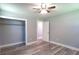 Cozy bedroom featuring updated floors, baseboard trim, closet, and neutral colored paint at 210 Froman Dr, Summerville, SC 29483