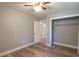 This bedroom is spacious with a closet, painted walls, base molding, and ceiling fan at 210 Froman Dr, Summerville, SC 29483