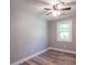 This bedroom has a ceiling fan, painted walls, base molding, and a window for natural light at 210 Froman Dr, Summerville, SC 29483