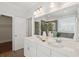 Bright bathroom featuring dual sinks, large mirror, and a separate shower and tub at 2242 Dewees Creek Dr, Mount Pleasant, SC 29466