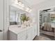 Bathroom featuring double vanity, quartz countertop, and view to bedroom at 2242 Dewees Creek Dr, Mount Pleasant, SC 29466