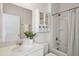 Clean bathroom featuring a shower, mirror, and cabinet with plants for a fresh feel at 2242 Dewees Creek Dr, Mount Pleasant, SC 29466