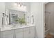 Bathroom featuring a double vanity, large mirror, and modern lighting for a stylish look at 2242 Dewees Creek Dr, Mount Pleasant, SC 29466