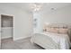 Relaxing bedroom showcasing a comfy bed with pink accents and serene, neutral walls at 2242 Dewees Creek Dr, Mount Pleasant, SC 29466