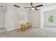 Bright bonus room with neutral carpet and ceiling fan with view to back porch at 2242 Dewees Creek Dr, Mount Pleasant, SC 29466