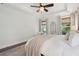 Bright main bedroom with a tray ceiling and hardwood floors at 2242 Dewees Creek Dr, Mount Pleasant, SC 29466
