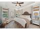 Serene main bedroom with a tray ceiling and lots of natural light at 2242 Dewees Creek Dr, Mount Pleasant, SC 29466