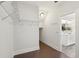 Walk-in closet with wire shelving and wood floors, connecting to the bathroom at 2242 Dewees Creek Dr, Mount Pleasant, SC 29466