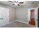 Bedroom features carpet floors, a ceiling fan, a closet, and an open door to another room at 225 Slipper Shell Ct, Mount Pleasant, SC 29464