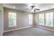 Spacious bedroom with neutral paint, carpet and large windows providing ample natural light at 225 Slipper Shell Ct, Mount Pleasant, SC 29464