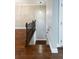 Hallway with hardwood floors and stairwell featuring a decorative railing at 225 Slipper Shell Ct, Mount Pleasant, SC 29464