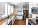 Well-lit kitchen with stainless steel appliances, granite countertops, and hardwood floors offers ample space at 225 Slipper Shell Ct, Mount Pleasant, SC 29464
